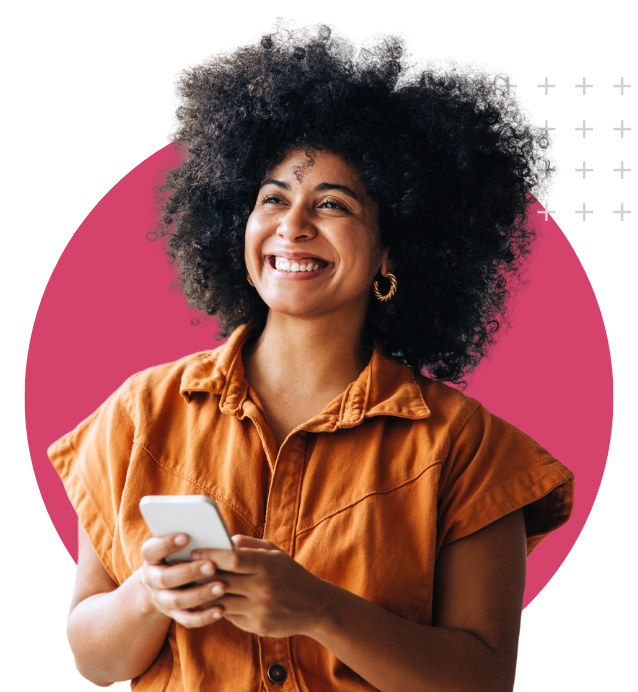 Girl Holding a phone and smiling at the camera